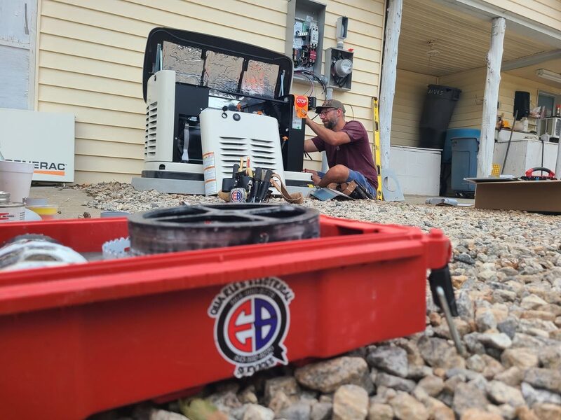 Quarles Electrical technician wiring a Generac standby generator
