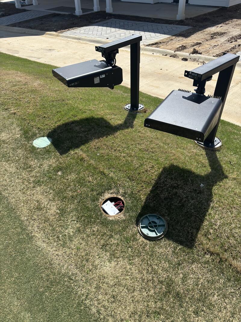 Newly installed exterior pole-mounted fixtures on a commercial property